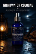 A cobalt blue glass spray bottle of Black Anchor Nightwatch Cologne stands on a dark wooden surface with a moody nighttime nautical background, complete with a lantern, rope, and a bright moon reflection. Bold white text at the top reads 'NIGHTWATCH COLOGNE' and 'CHARISMATIC, MASCULINE, PERFECT'.
